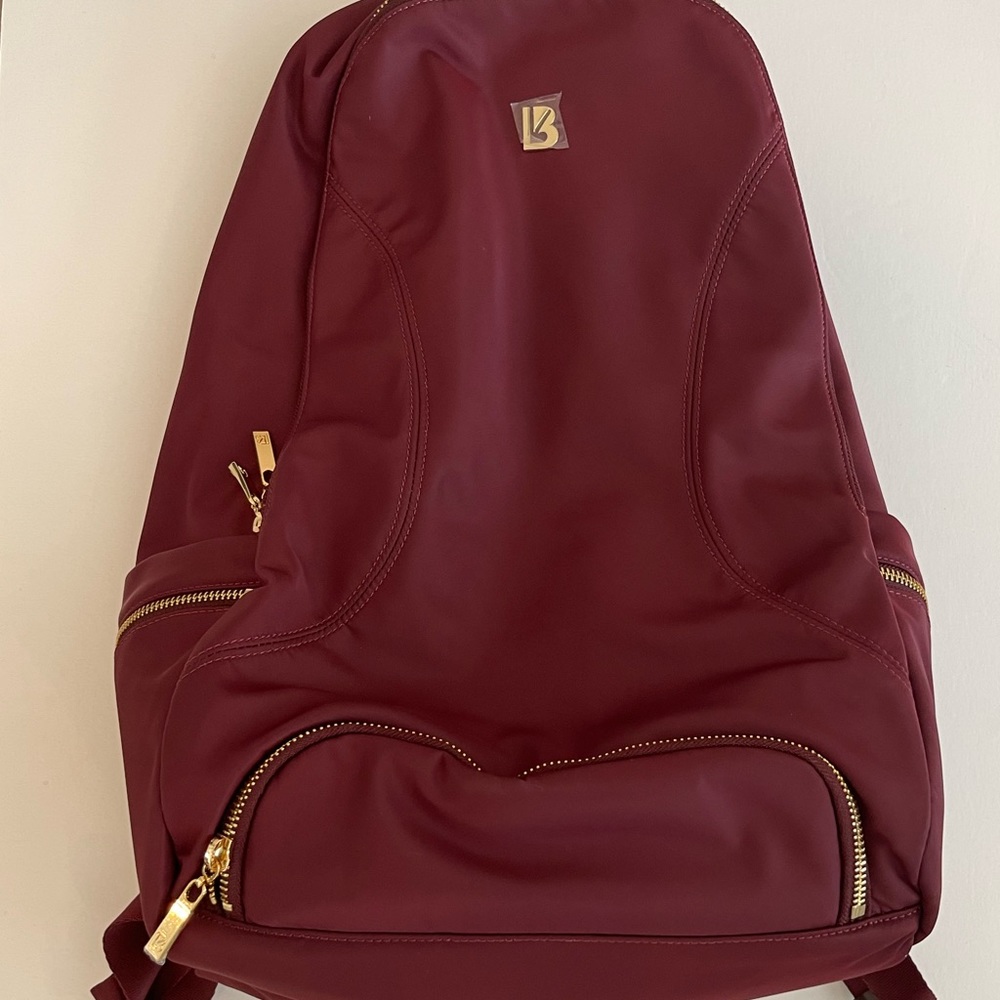 Buffbunny NWT gamechanger backpack wine with gold hardware.